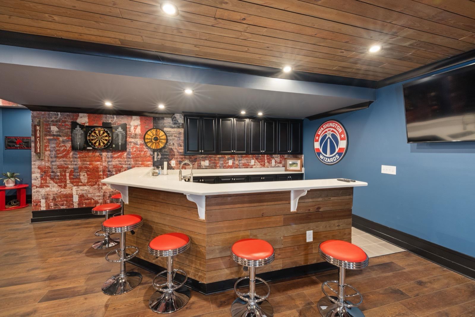 Finished basement wet bar with a wood-plank ceiling — AMV Construction, Charlotte NC