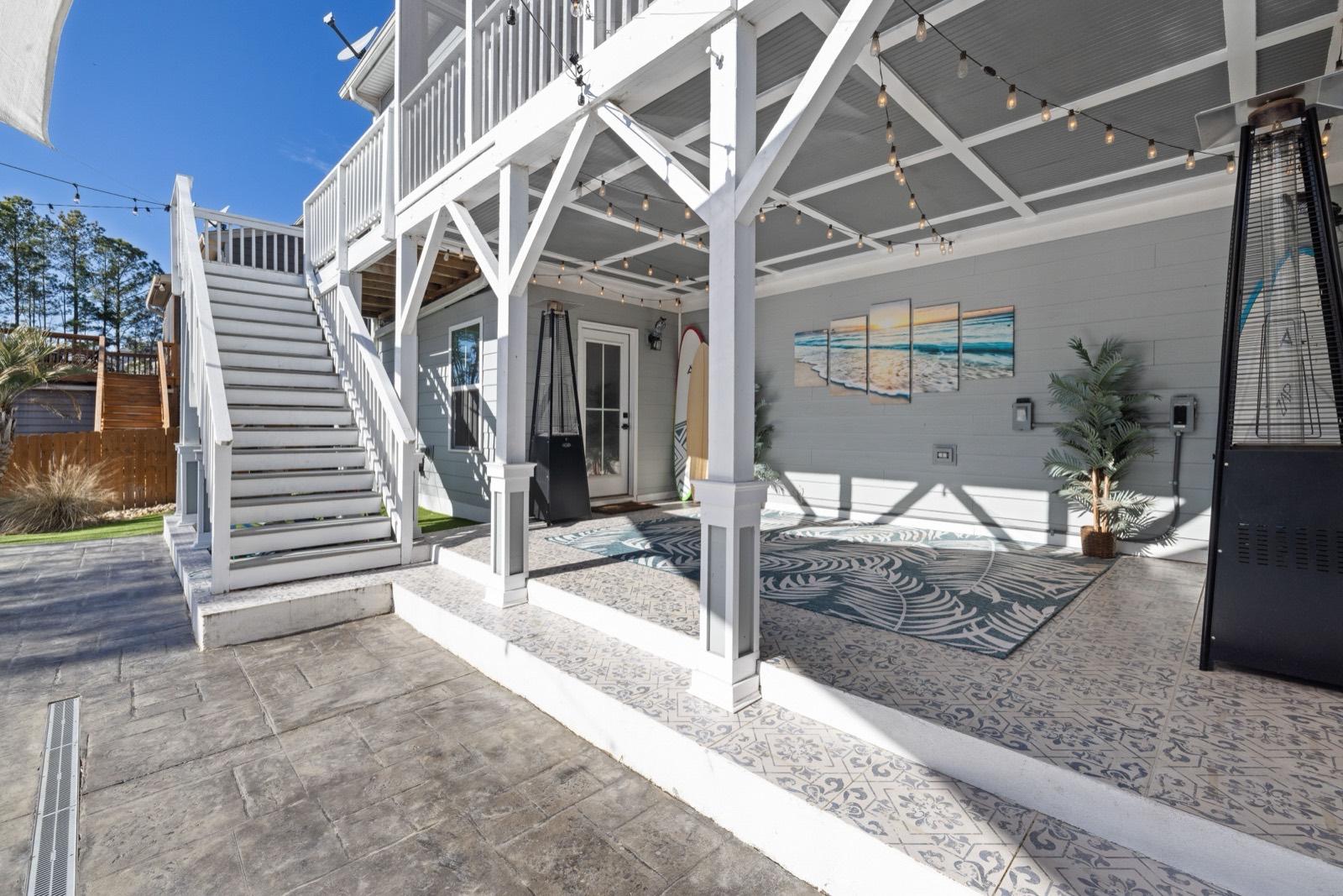 Covered under-deck patio with painted stairs and columns — AMV Construction, Charlotte NC