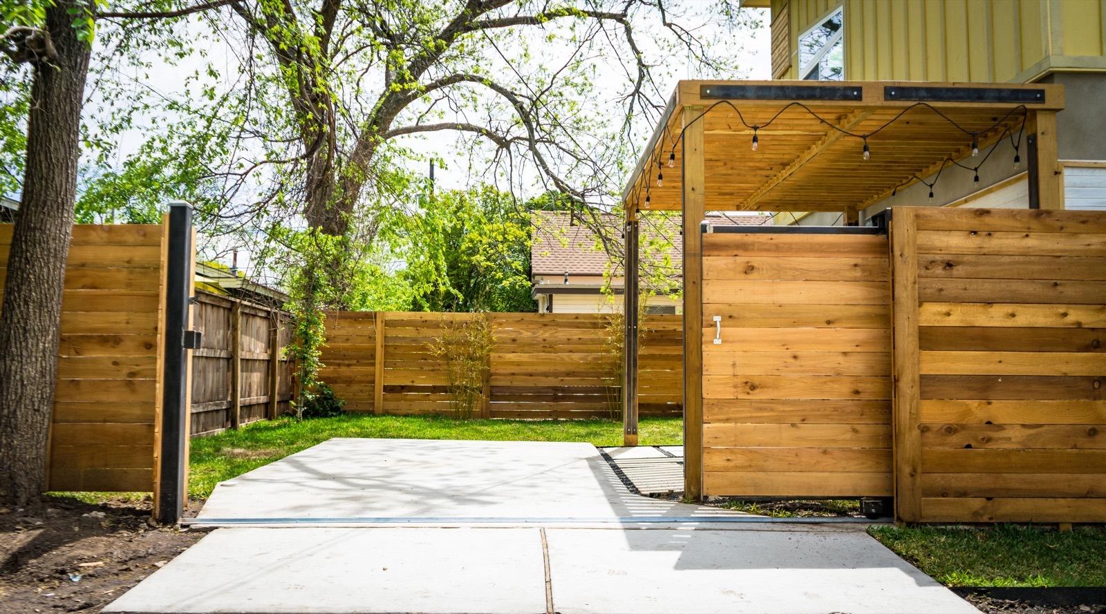 Cedar privacy fence with a matching gate and pergola — AMV Construction, Charlotte NC