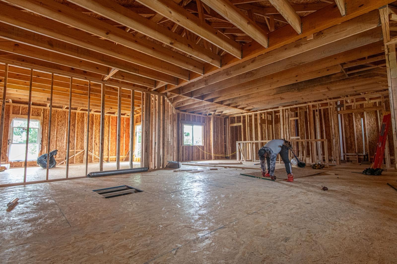 Interior framing with new floor joists and stud walls — framing project by AMV Construction in Charlotte, NC