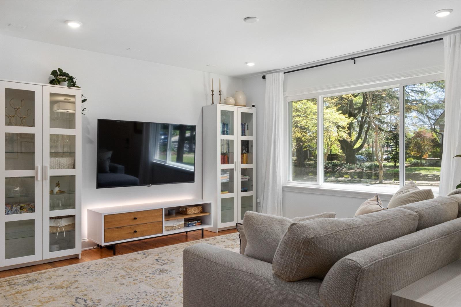 Bright living room with freshly painted walls and built-in cabinetry — AMV Construction, Charlotte NC