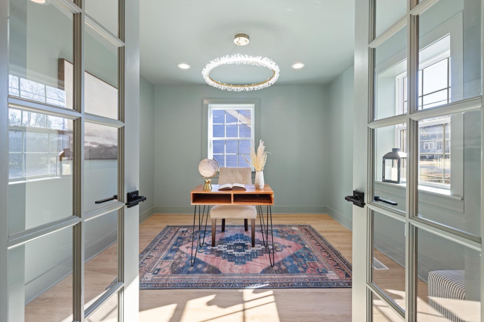 Home office behind glass-panel French doors — AMV Construction, Charlotte NC