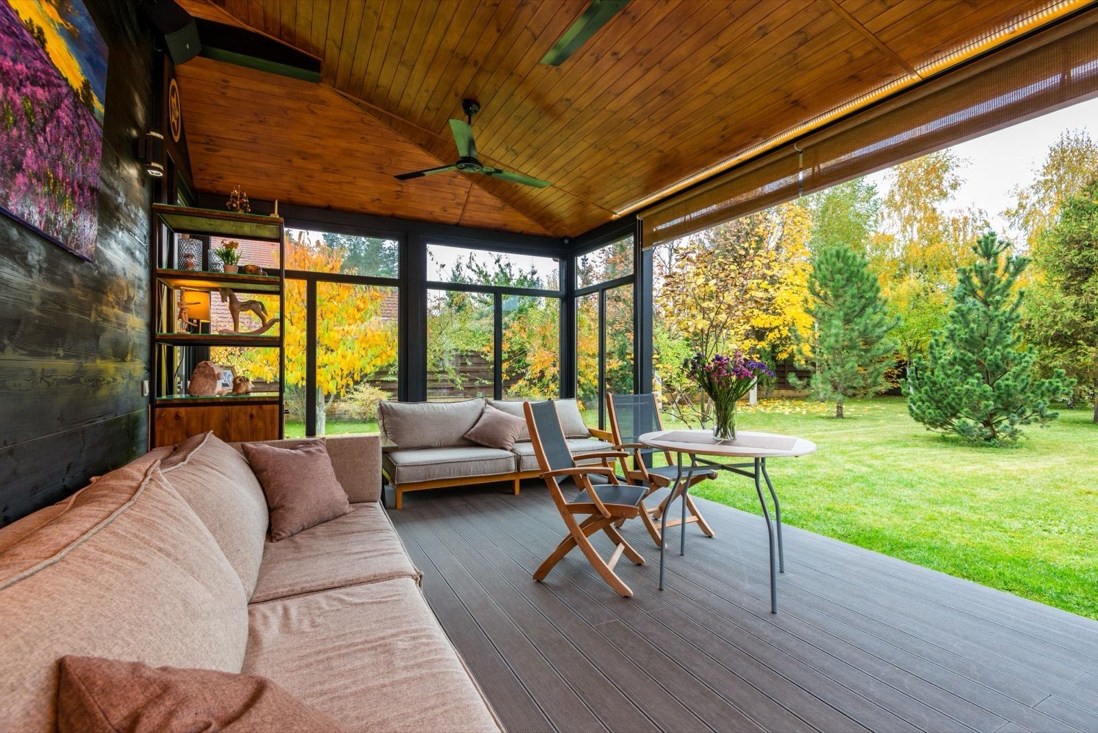 Covered porch with a stained wood ceiling and built-in lounge seating — AMV Construction, Charlotte NC