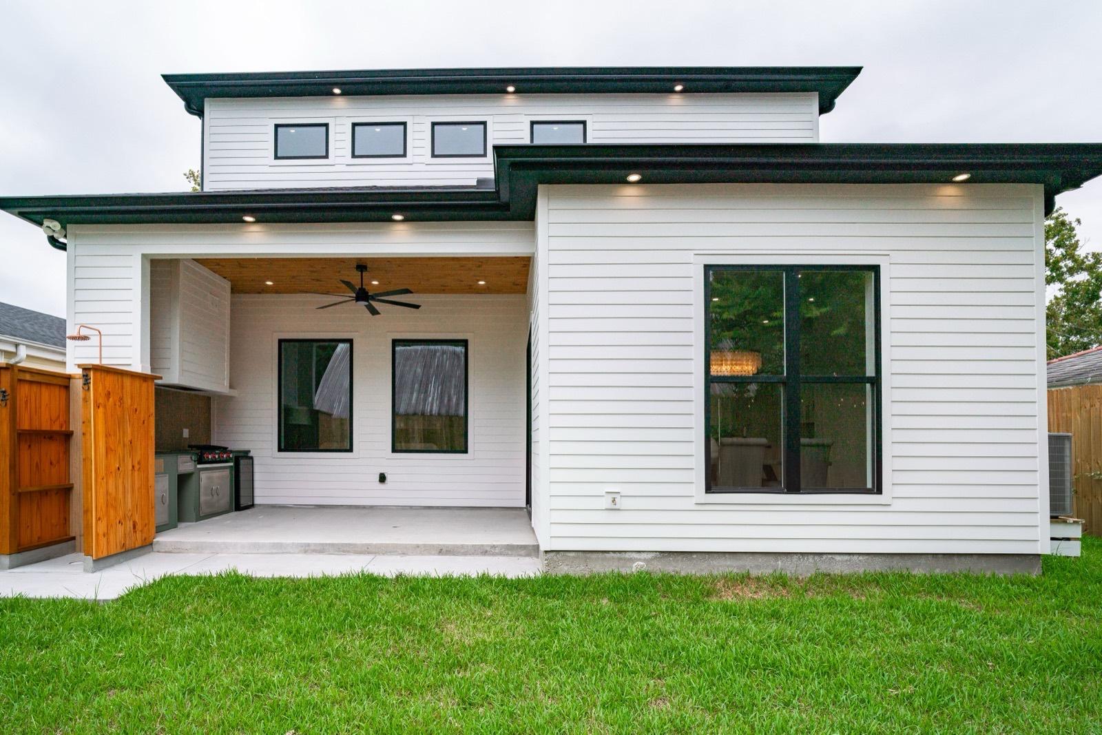 Rear elevation in white lap siding with a covered patio — AMV Construction, Charlotte NC