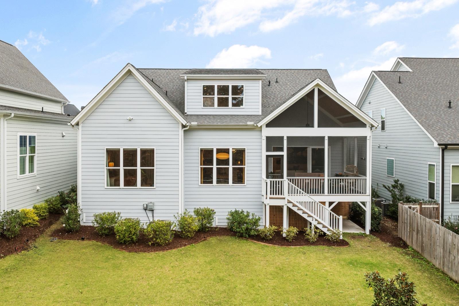 Rear elevation in white lap siding with a screened porch — AMV Construction, Charlotte NC