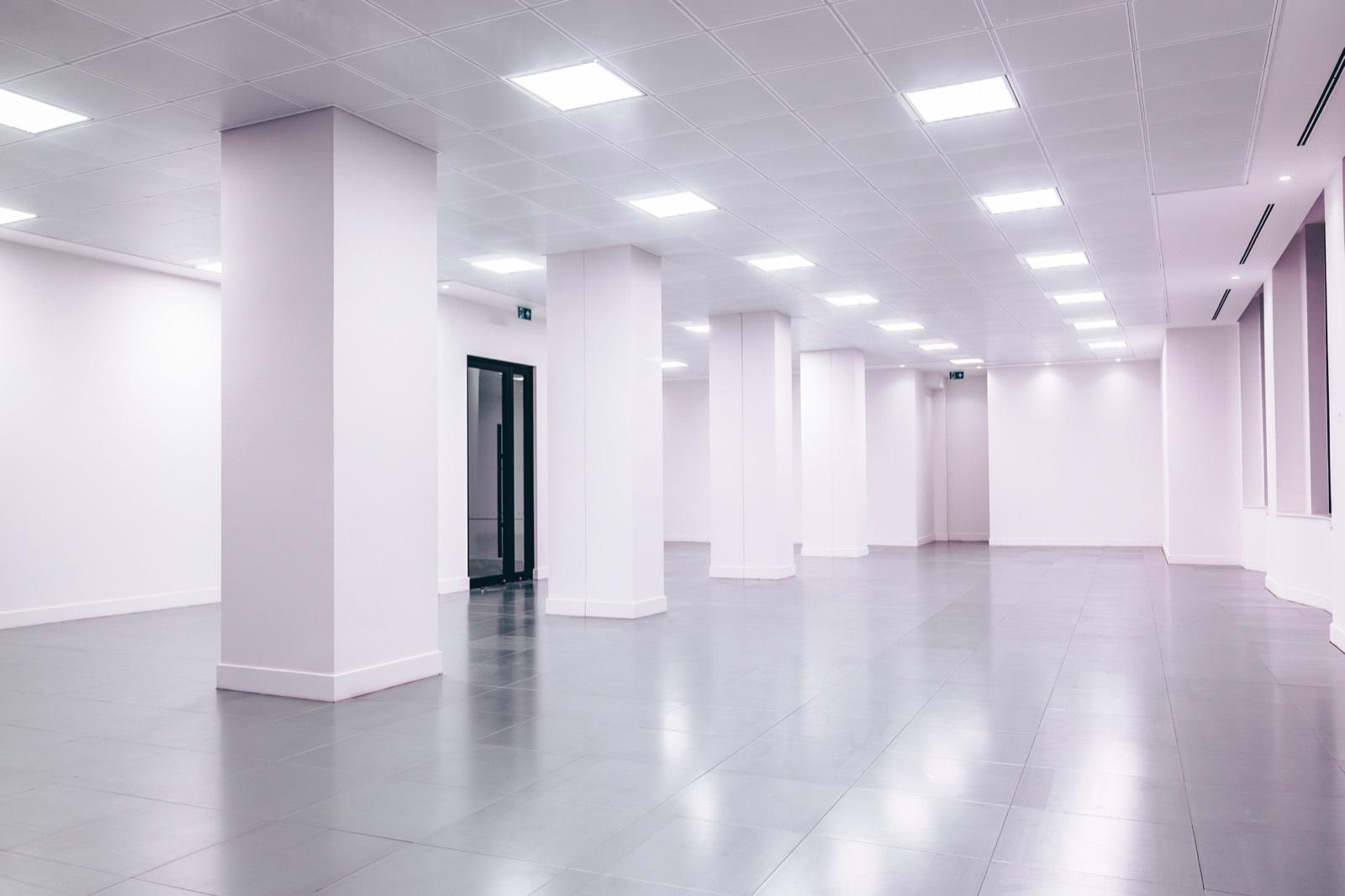 Open commercial floor plate with new lighting and tile flooring — AMV Construction, Charlotte NC