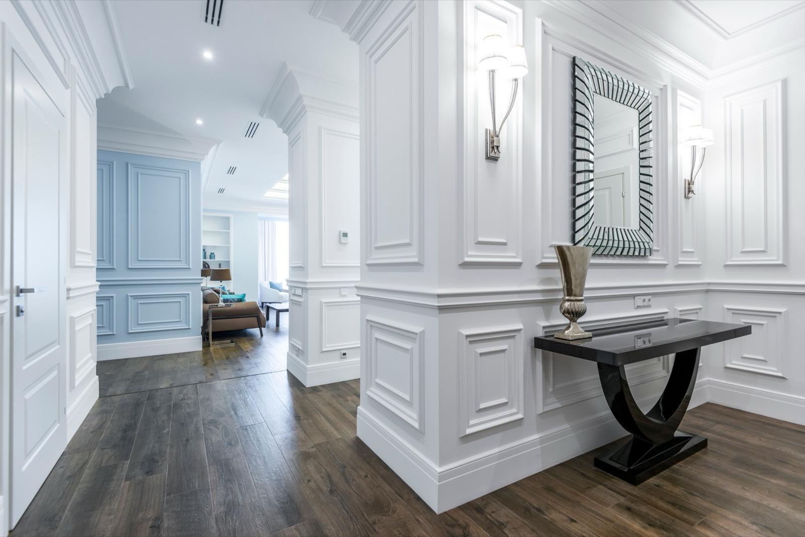 Entry hall with white raised-panel wainscot and dark hardwood floors — AMV Construction, Charlotte NC