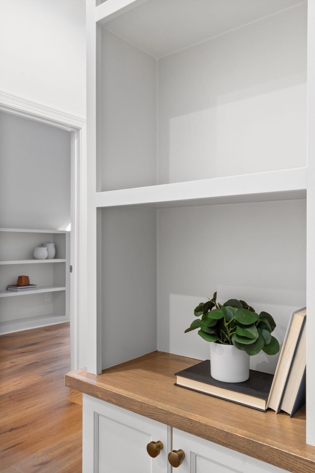 Built-in shelving detail with a natural wood ledge — AMV Construction, Charlotte NC