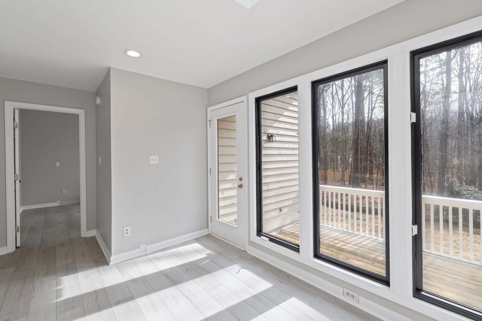 Bonus room with a window wall and a new door onto the deck — AMV Construction, Charlotte NC